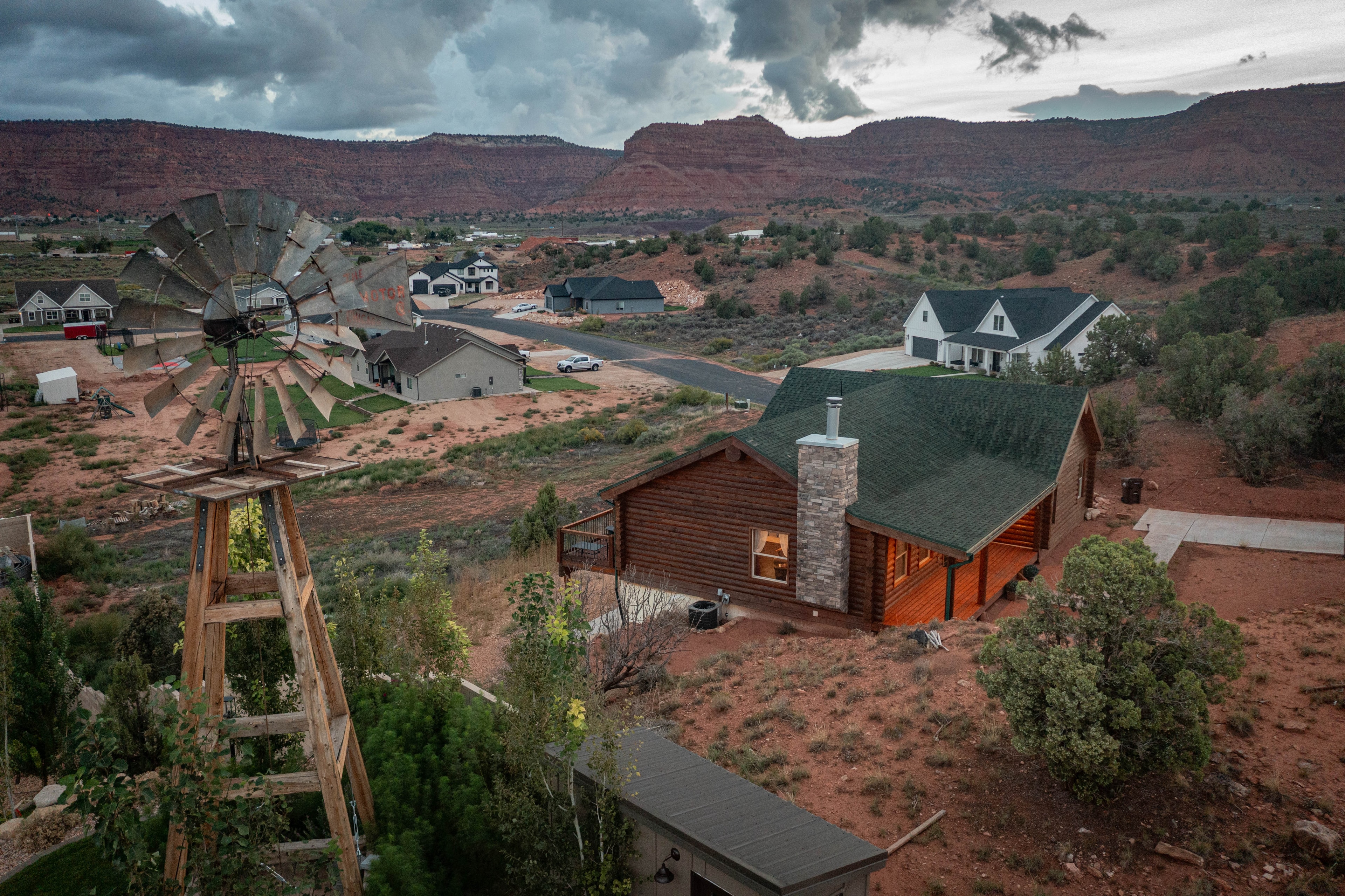 Aerial drone photography of Southern Utah property near Kanab — rural homes windmill red rock valley