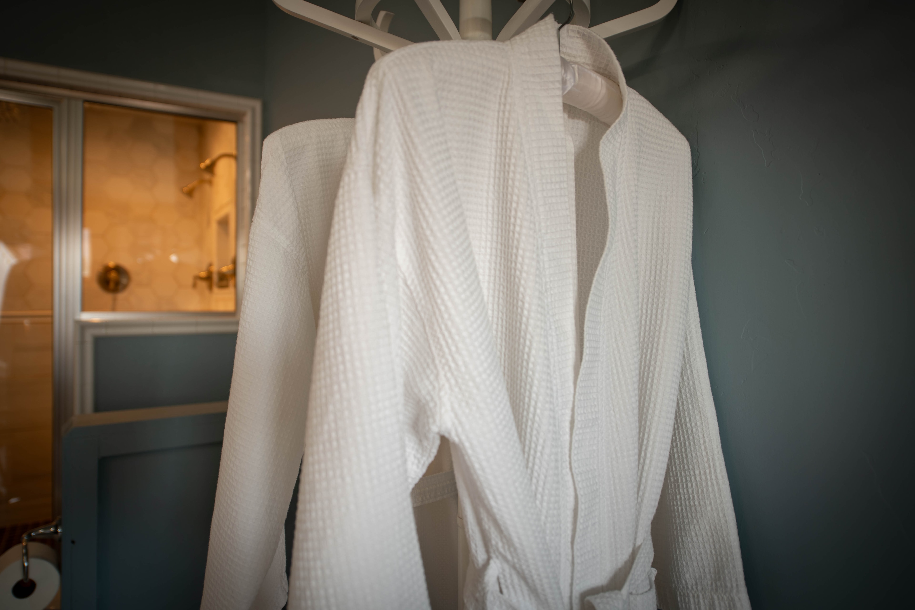 White waffle robes on rack — Kanab vacation rental luxury amenities