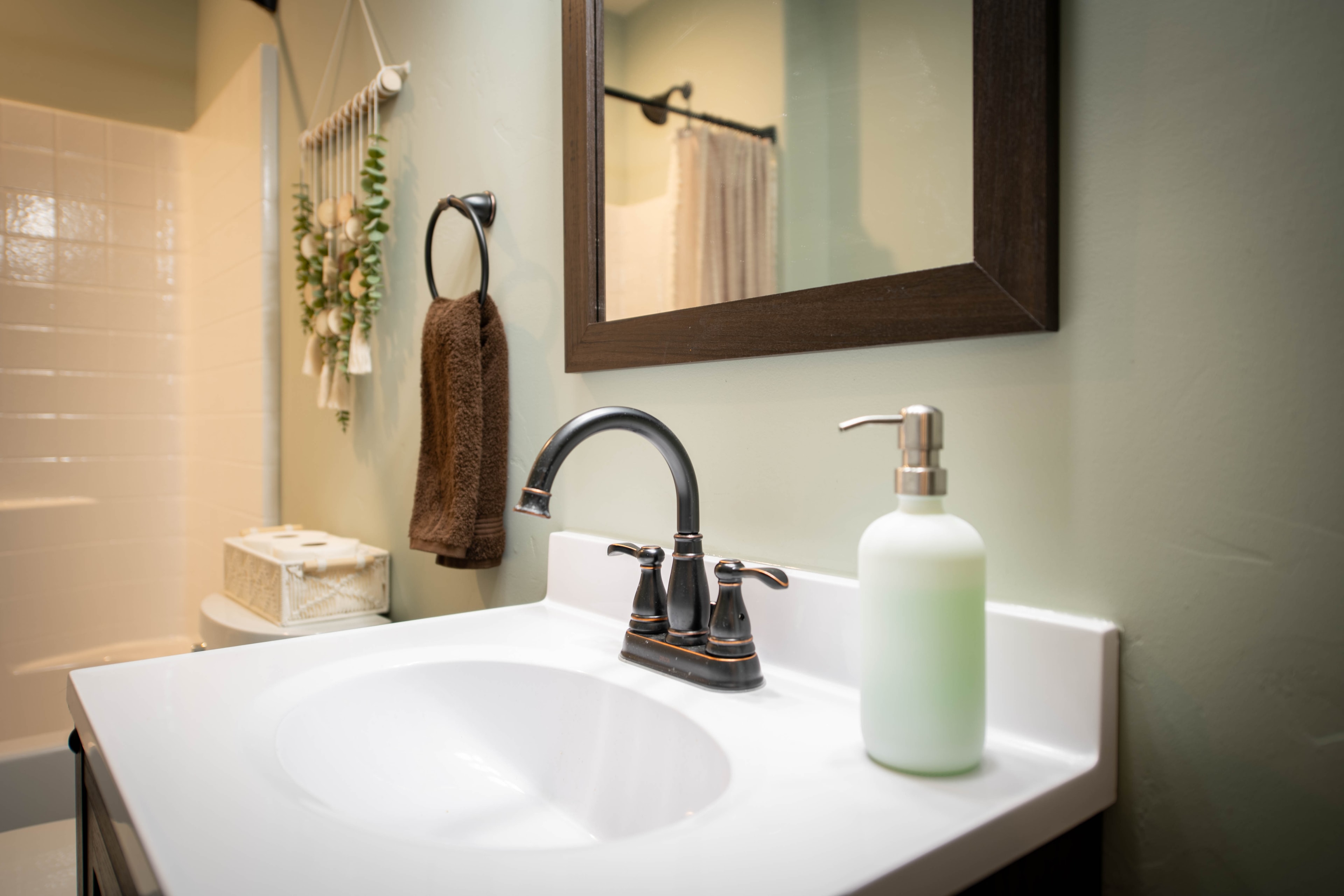 Modern bathroom vanity with sink and mirror — Kanab vacation rental interior